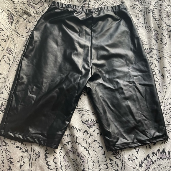Fashion Nova leather biker shorts and blue shirt - Picture 6 of 6